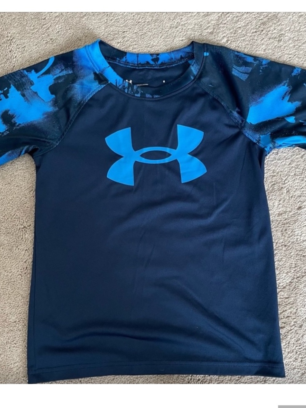 Under Armour Navy Rashguard material with Bright Blue Logo and Camo Sleeves